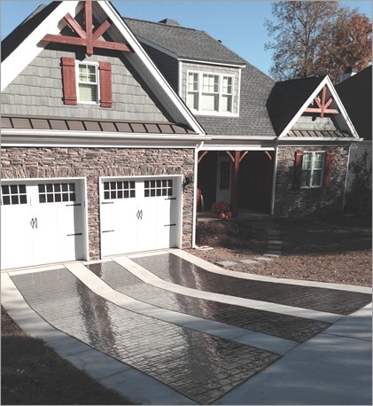 Driveway combining multiple finish options like stamped cobblestone with “broom-swept” concrete