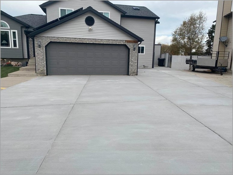 restorekoat finish in gray placed as a concrete overlay on a driveway