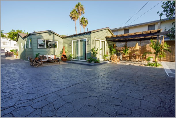 Hand stamped slate gray flagstone concrete driveway or courtyard of home 