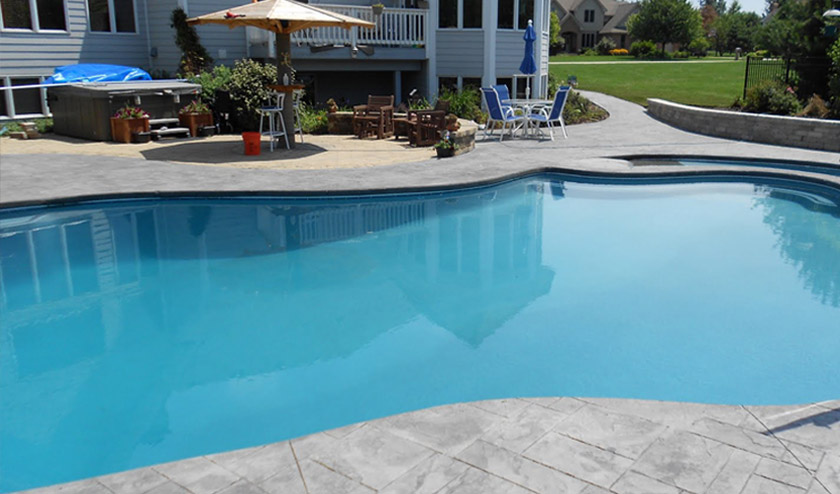 Stamped pooldeck in umbrella grey